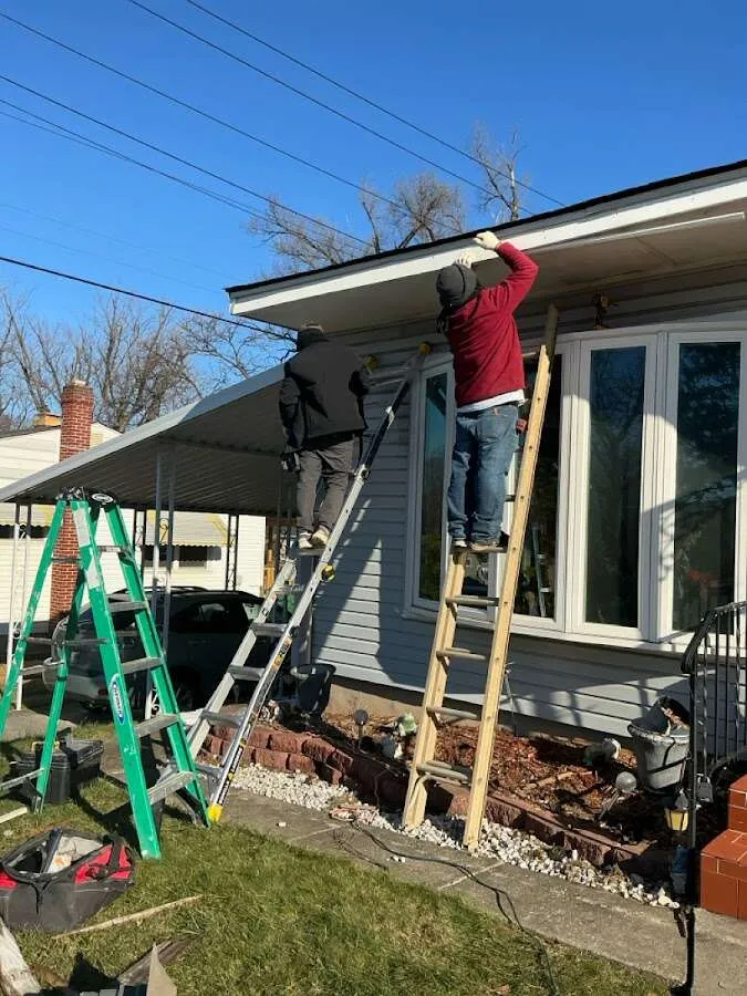 Restoration crew performing exterior repair in Two Rivers